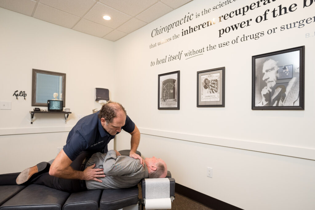 Precision Chiropractic of Durham NC Dr David Martin adjusting Patient Chiropractic Care