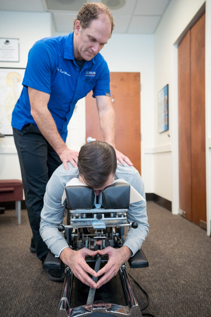 Precision Chiropractic of Durham NC Dr David Martin adjusting Patient Chiropractic Care