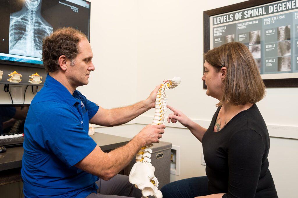 Precision Chiropractic of Durham NC Dr David Martin adjusting Patient Chiropractic Care