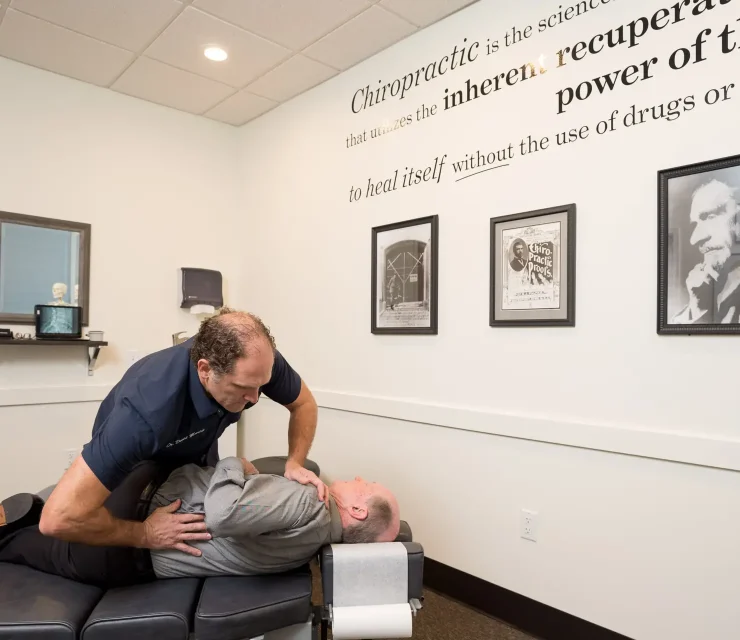 Precision Chiropractic of Durham NC Dr David Martin adjusting Patient Chiropractic Care