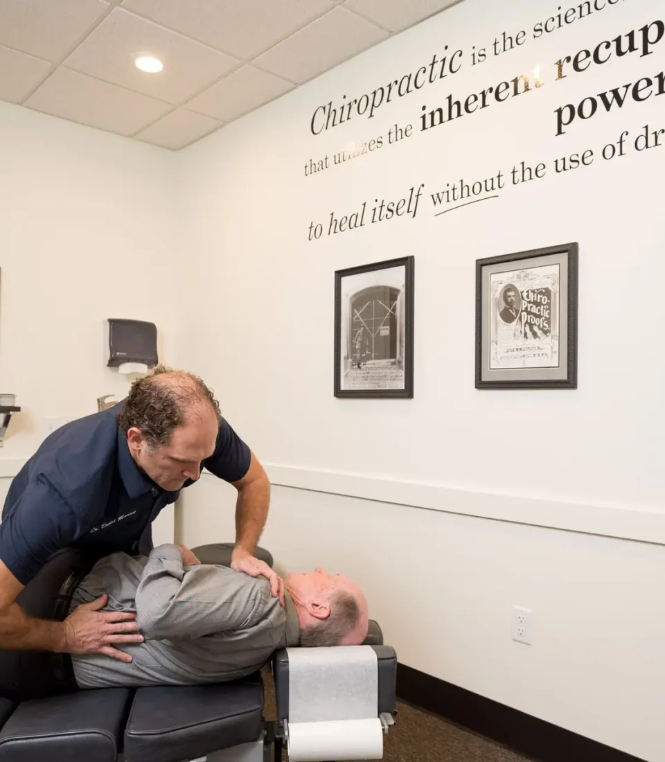 Precision Chiropractic of Durham NC Dr David Martin adjusting Patient Chiropractic Care