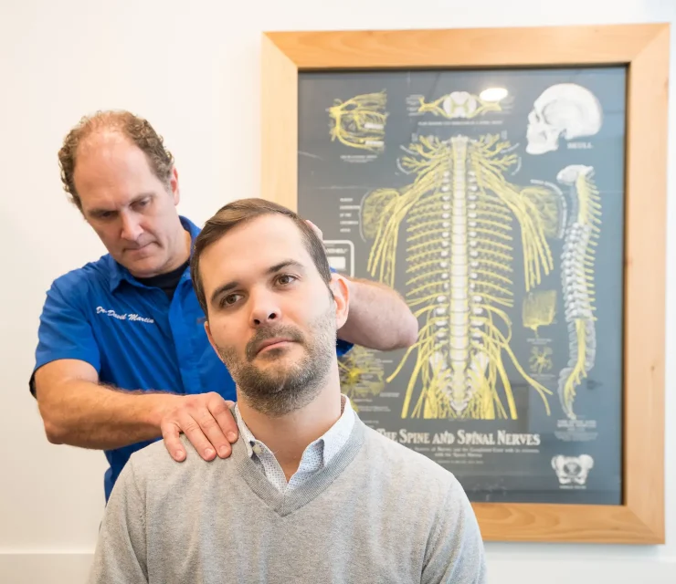 Precision Chiropractic of Durham NC Dr David Martin adjusting Patient Chiropractic Care