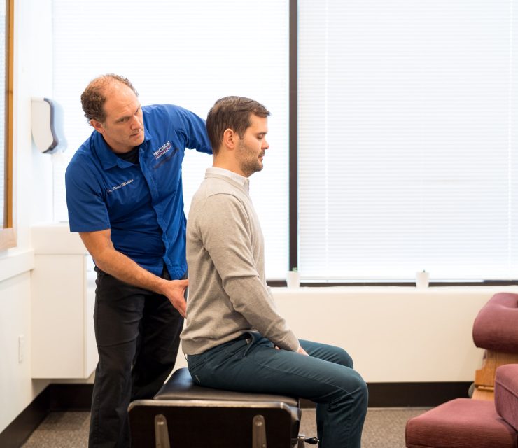 Precision Chiropractic of Durham NC Dr David Martin adjusting Patient Chiropractic Care