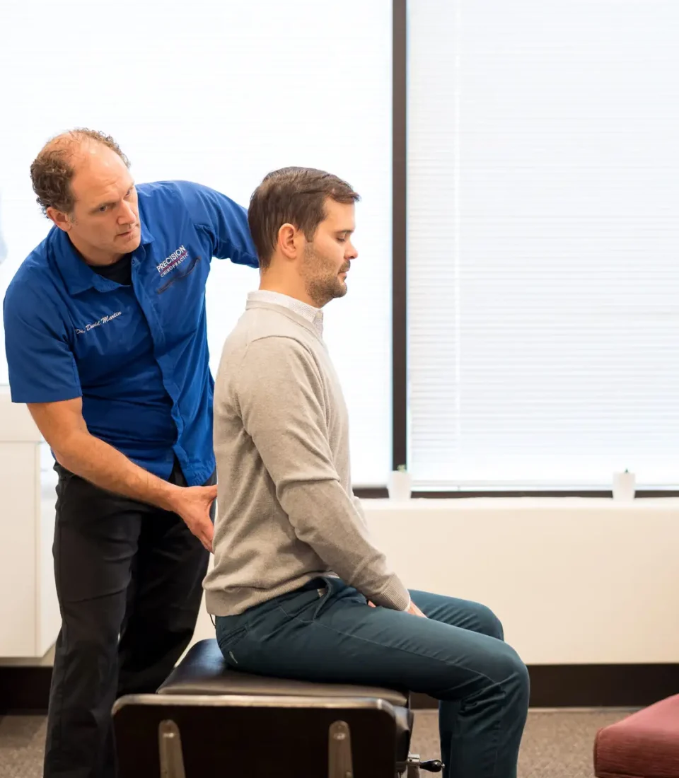 Precision Chiropractic of Durham NC Dr David Martin adjusting Patient Chiropractic Care