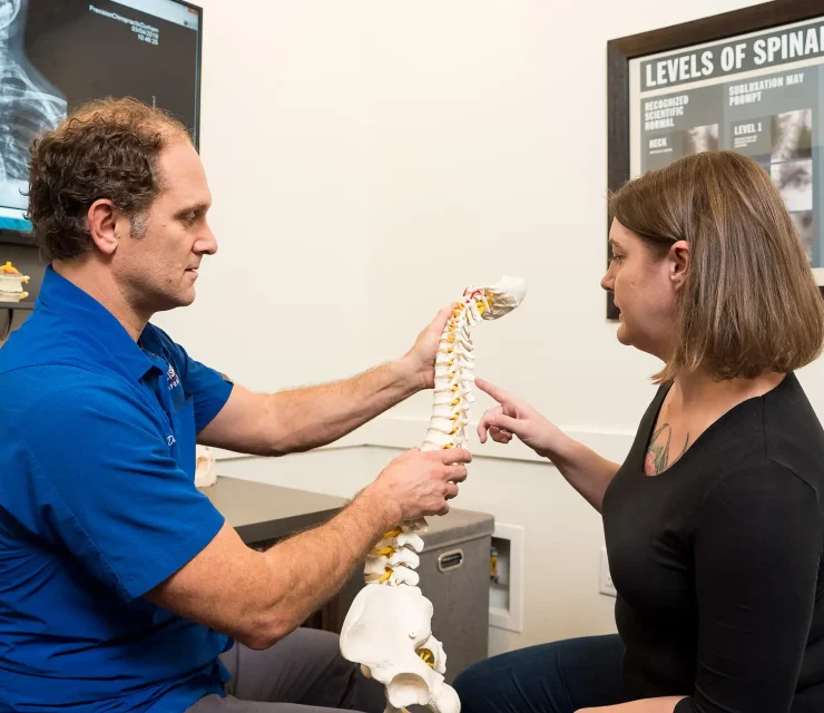 Precision Chiropractic of Durham NC Dr David Martin adjusting Patient Chiropractic Care